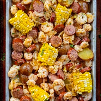 Easy Shrimp Boil in a Pan on a Dark Cutting Board.