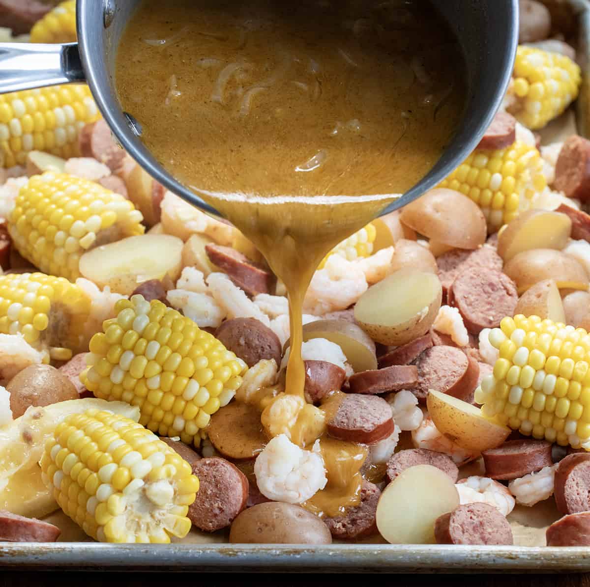 Adding Sauce to Easy Shrimp Boil.