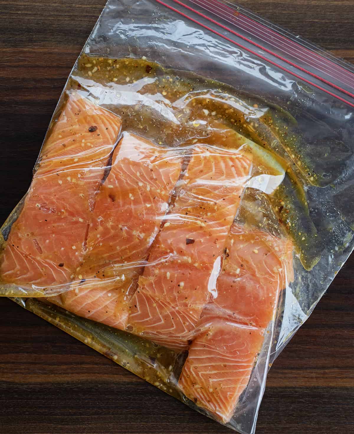 Raw Salmon Marinating in a Plastic Bag.