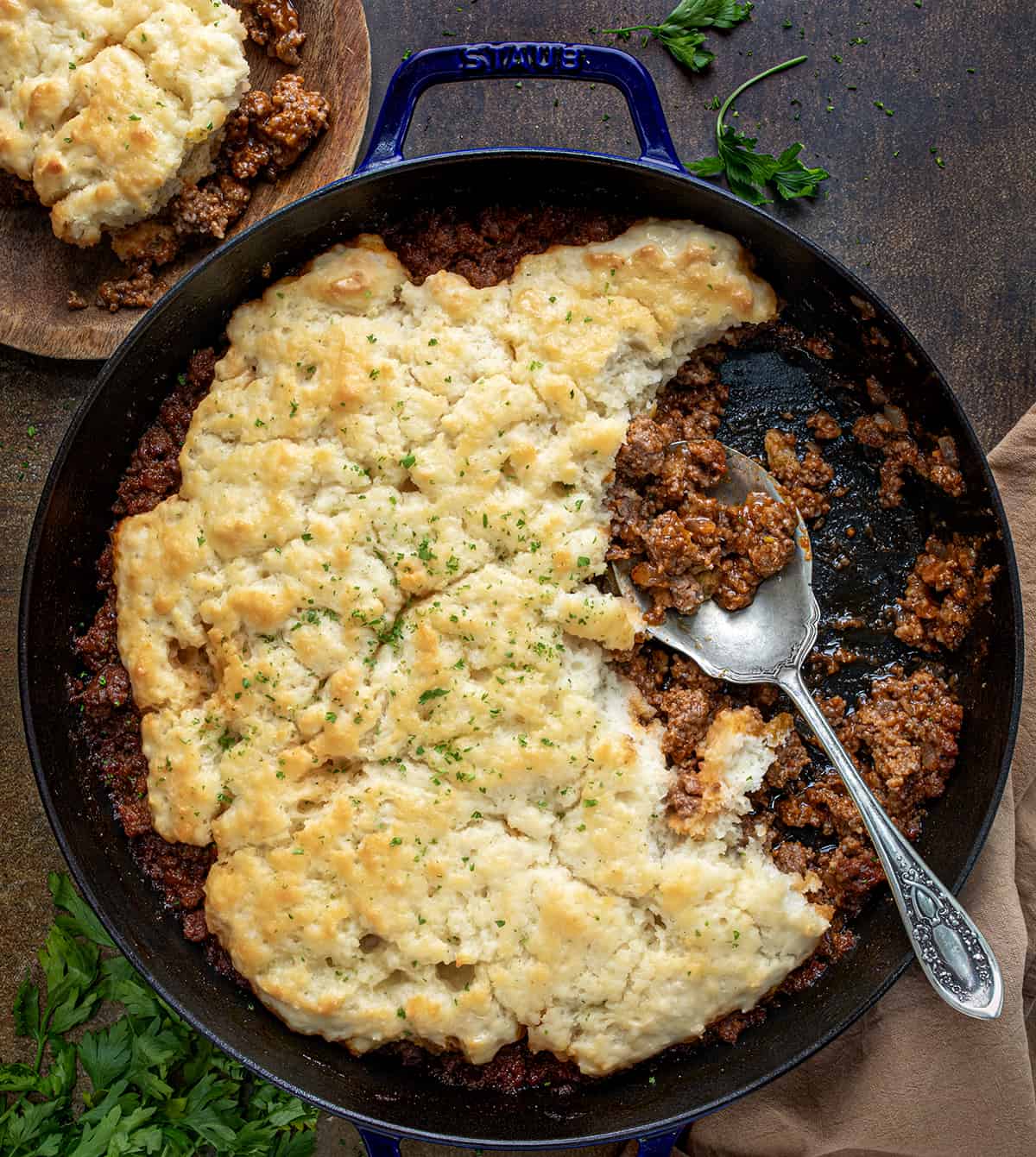 Skillet of Butter Swim Biscuit Sloppy Joe Bake with Some Removed Showing Texture Inside. 