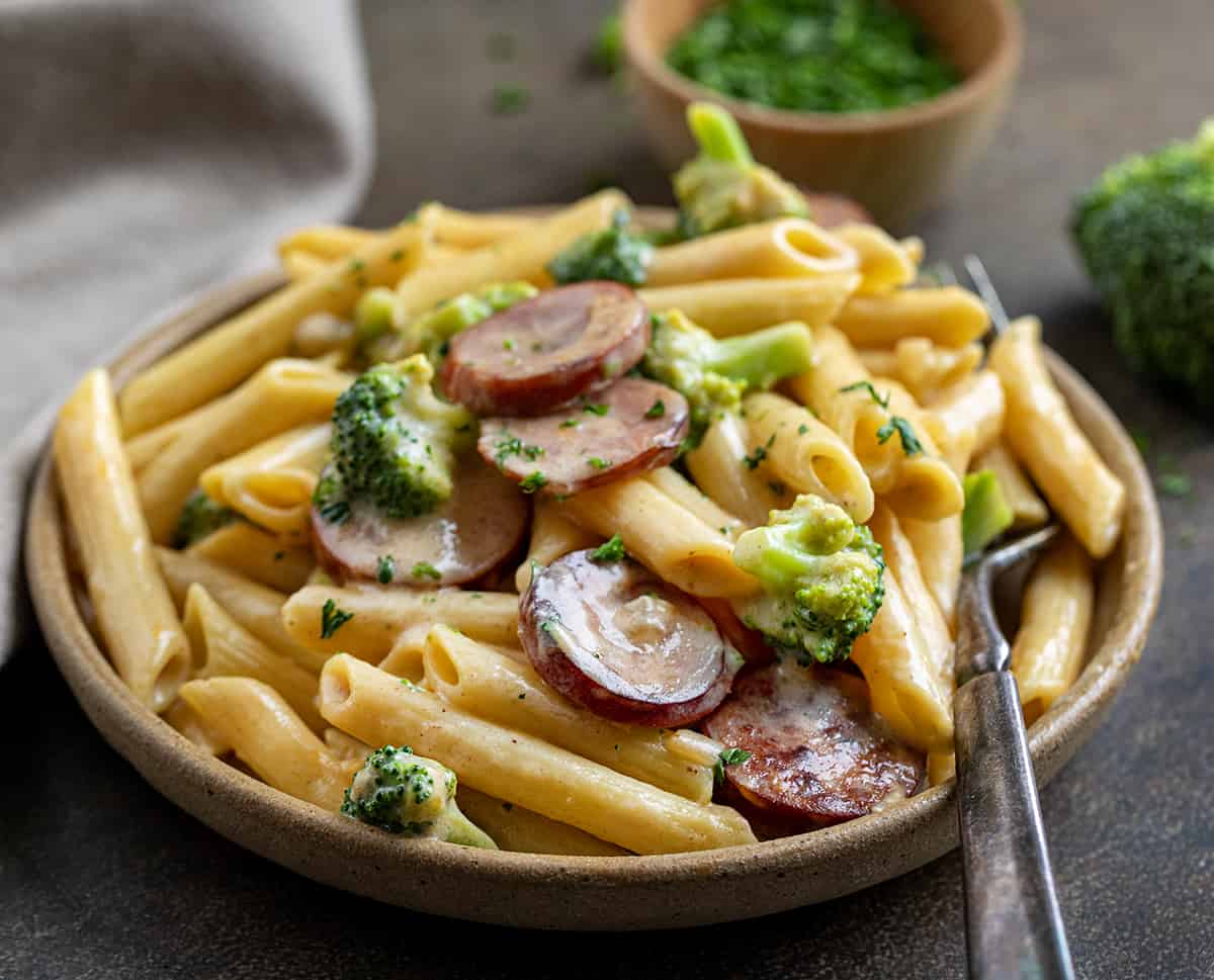 Plate of Creamy Kielbasa Broccoli Skillet on a Dark Table.