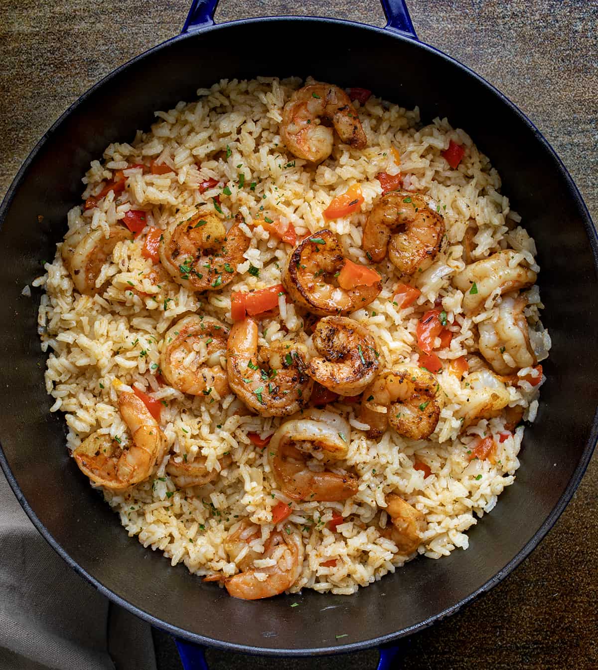 Pan of Cajun Shrimp and Rice on a Wooden Table  from Overhead.