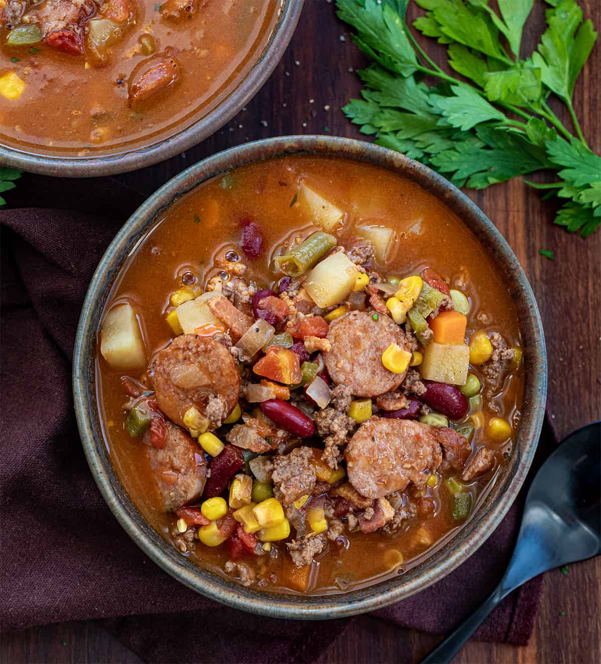 Bowls of Cowboy Stew on a Dark Table.