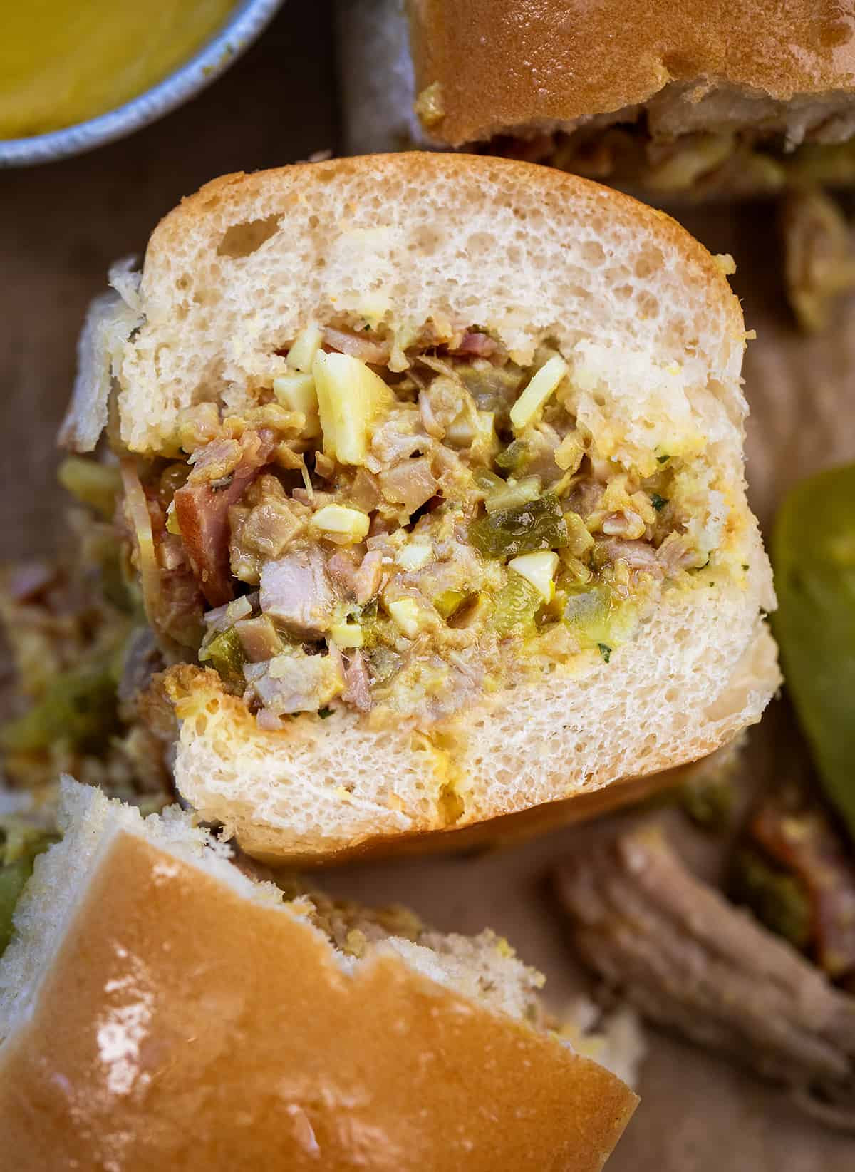 Close up of Cuban Chopped Grinder Sandwich in a Pan.