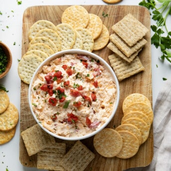 Cracker board with Pimento Cheese dip on it.