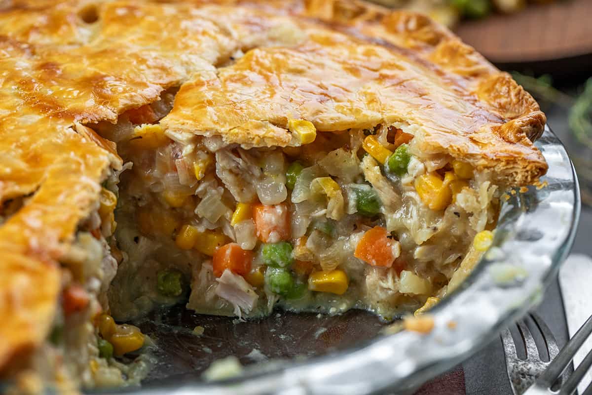 Pan of Turkey Pot Pie with Some pieces missing but showing the inside.