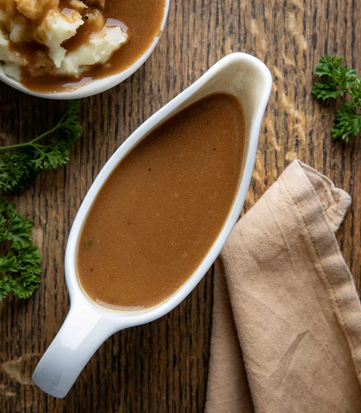 Bowl of Homemade Brown Gravy Mix on a table from overhead.