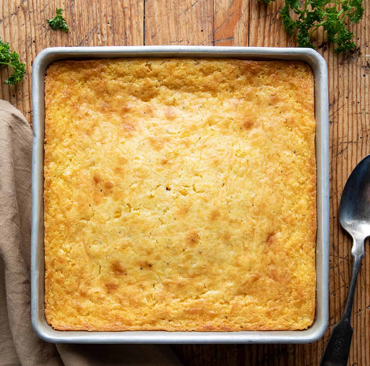 Pan of Southern Corn Pudding on a table from overhead.