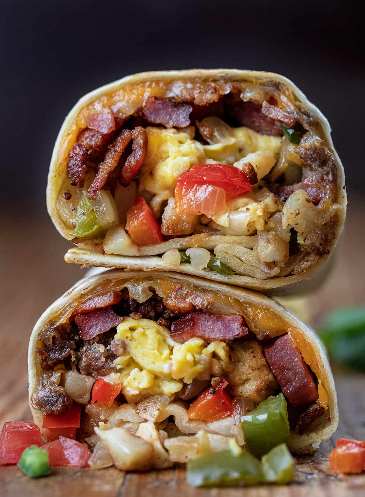 Cut in half Cowboy Breakfast Burrito with both cut ends showing.
