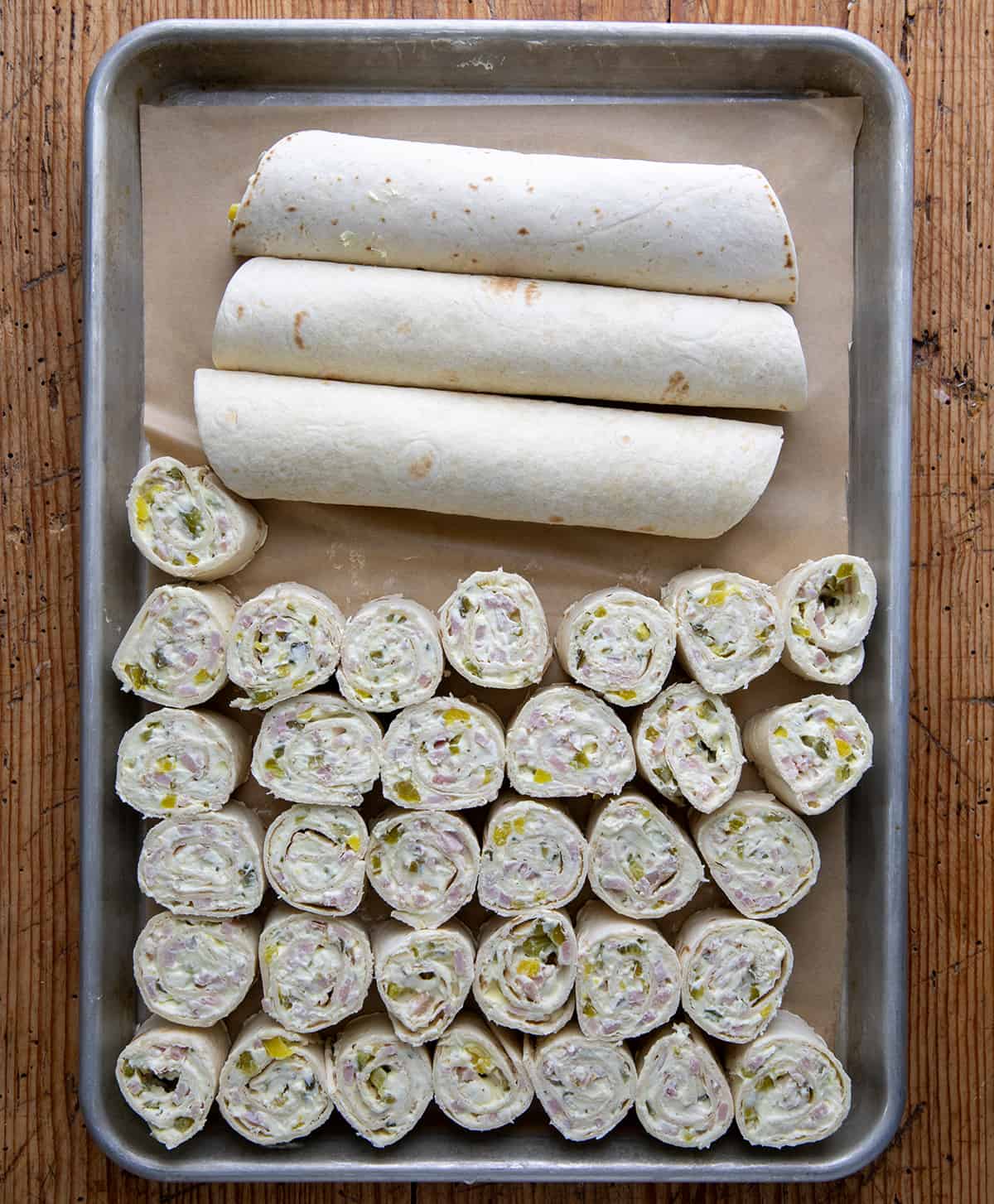 Rolled up Ham and Pickle Pinwheels as well as cut up pinwheels.