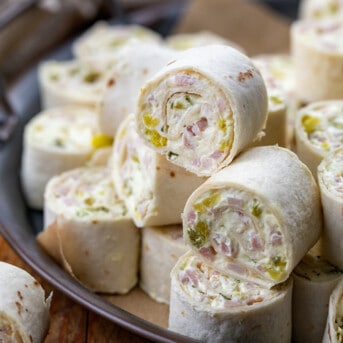 Close up of Ham and Pickle Pinwheels on a platter.