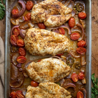 Sheet Pan Roasted Salsa Chicken on a table from overhead.