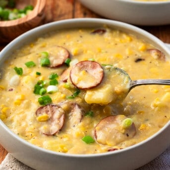 Spoonful of Andouille Corn Chowder over a bowl.