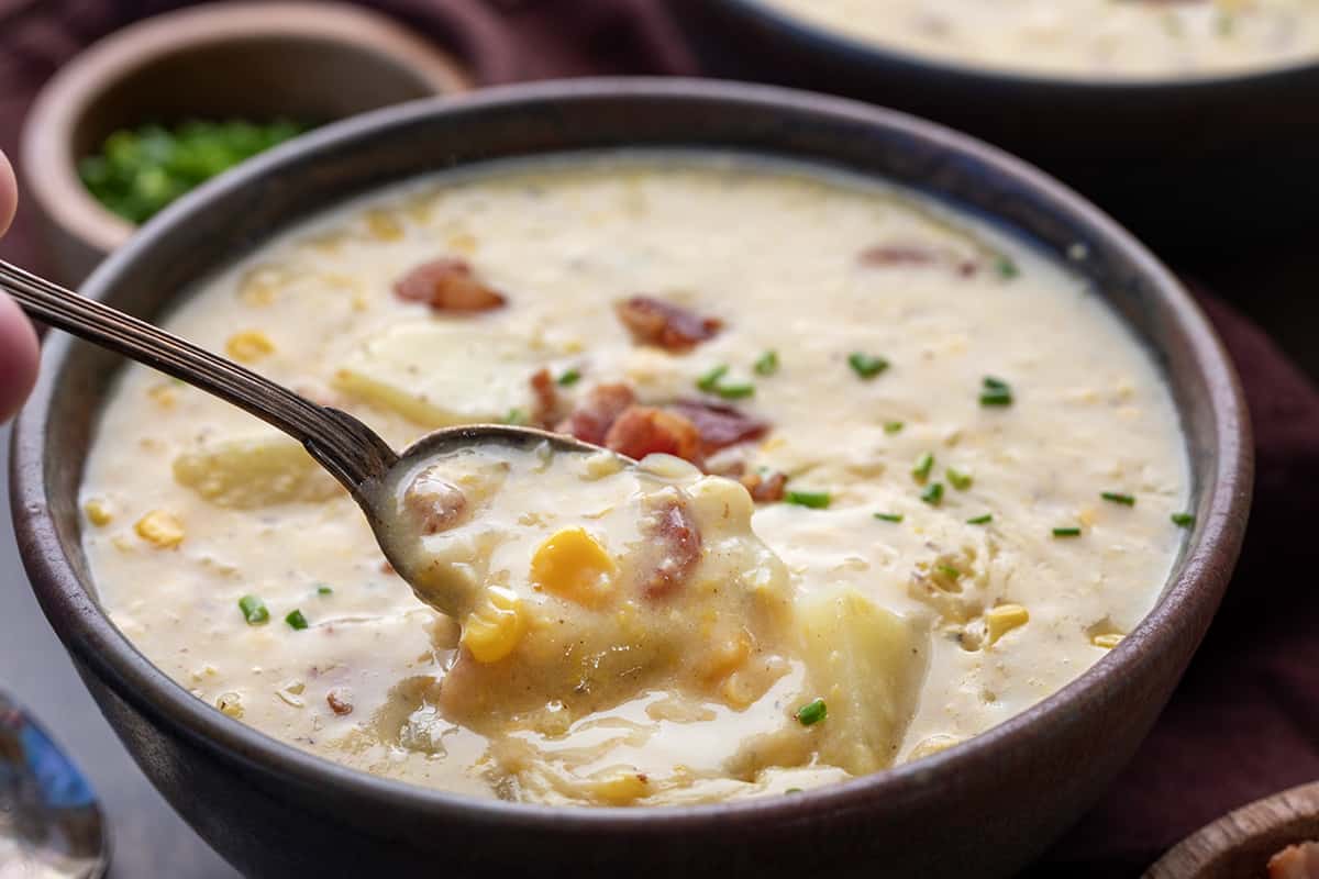 Spoon in a bowl of Corn Chowder.