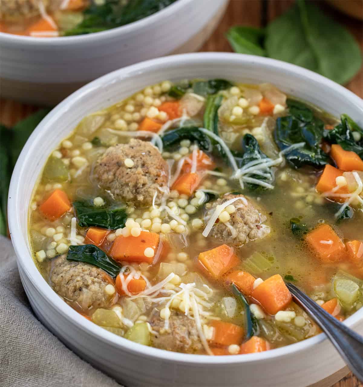 Close up of bowls of Italian Wedding Soup.