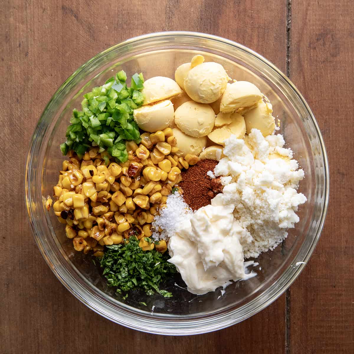Raw ingredients for Street Corn Deviled Eggs in a bowl.