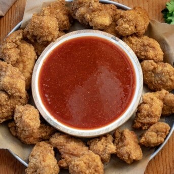 Plate of nuggets around a bowl of Firecracker Sauce.