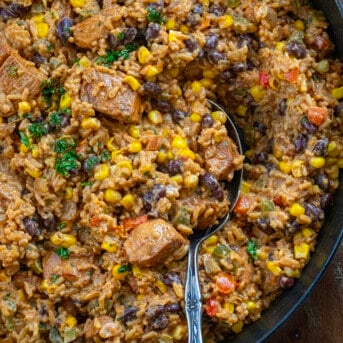 Skillet of Southwest Chicken and Rice with a spoon in it.