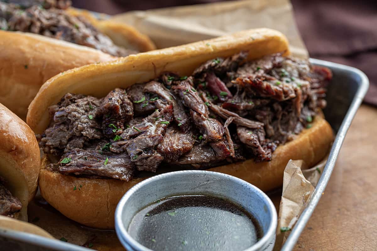 Close up of a French Dip sandwich showing the tender meat.
