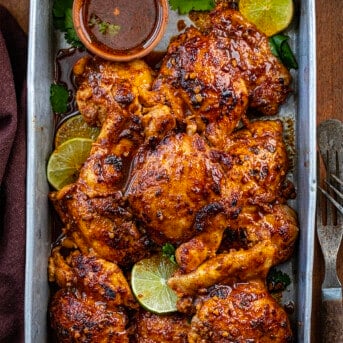 Platter of Chili Lime Chicken on a wooden table from overhead.