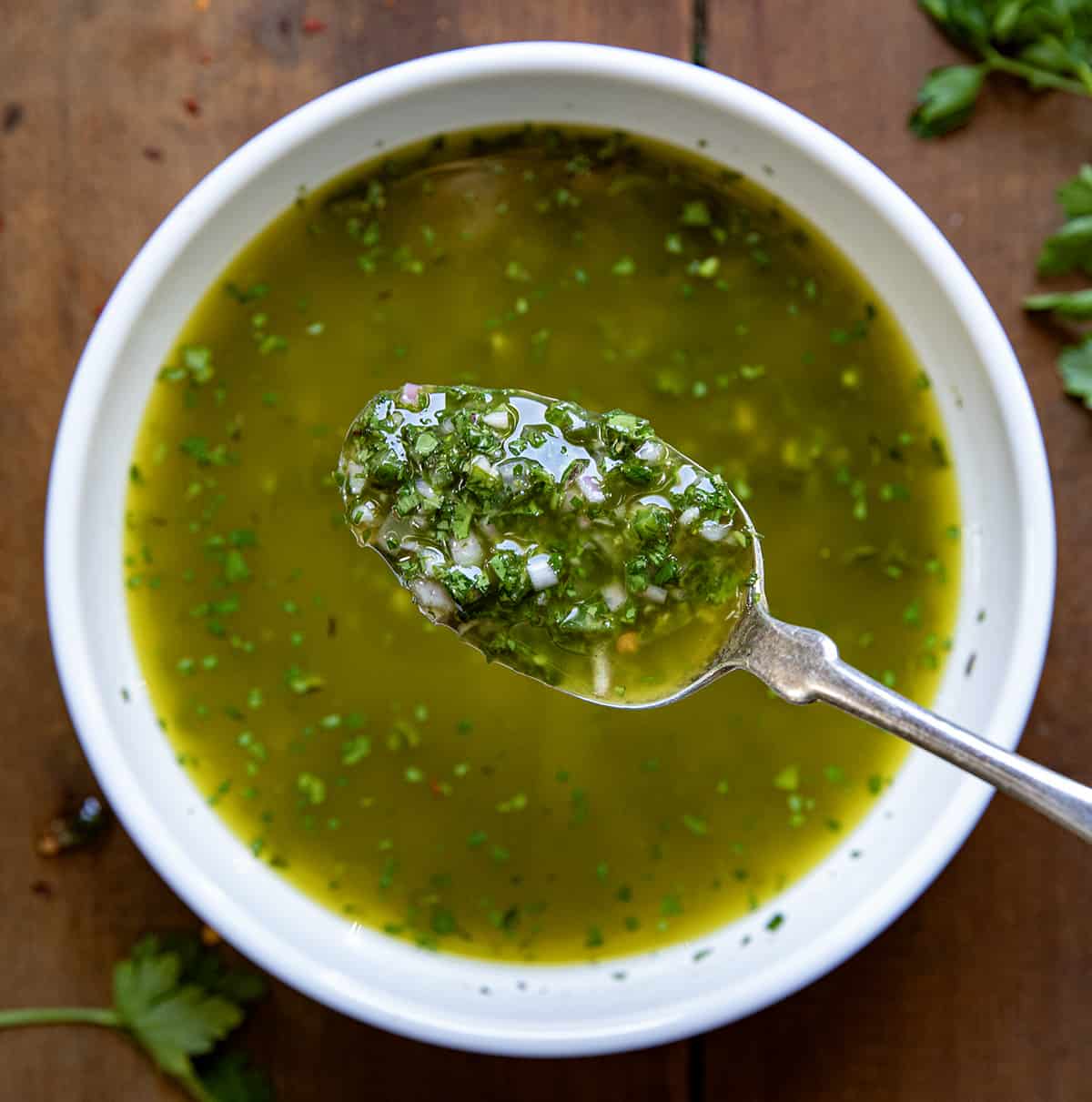 Bowl of Chimichurri Sauce with a spoonful.