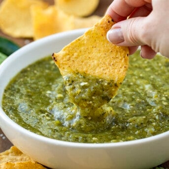 Dipping a chip into Salsa Verde.
