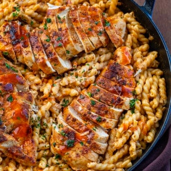 Close up of Creamy Buffalo Chicken Pasta in a skillet from overhead.