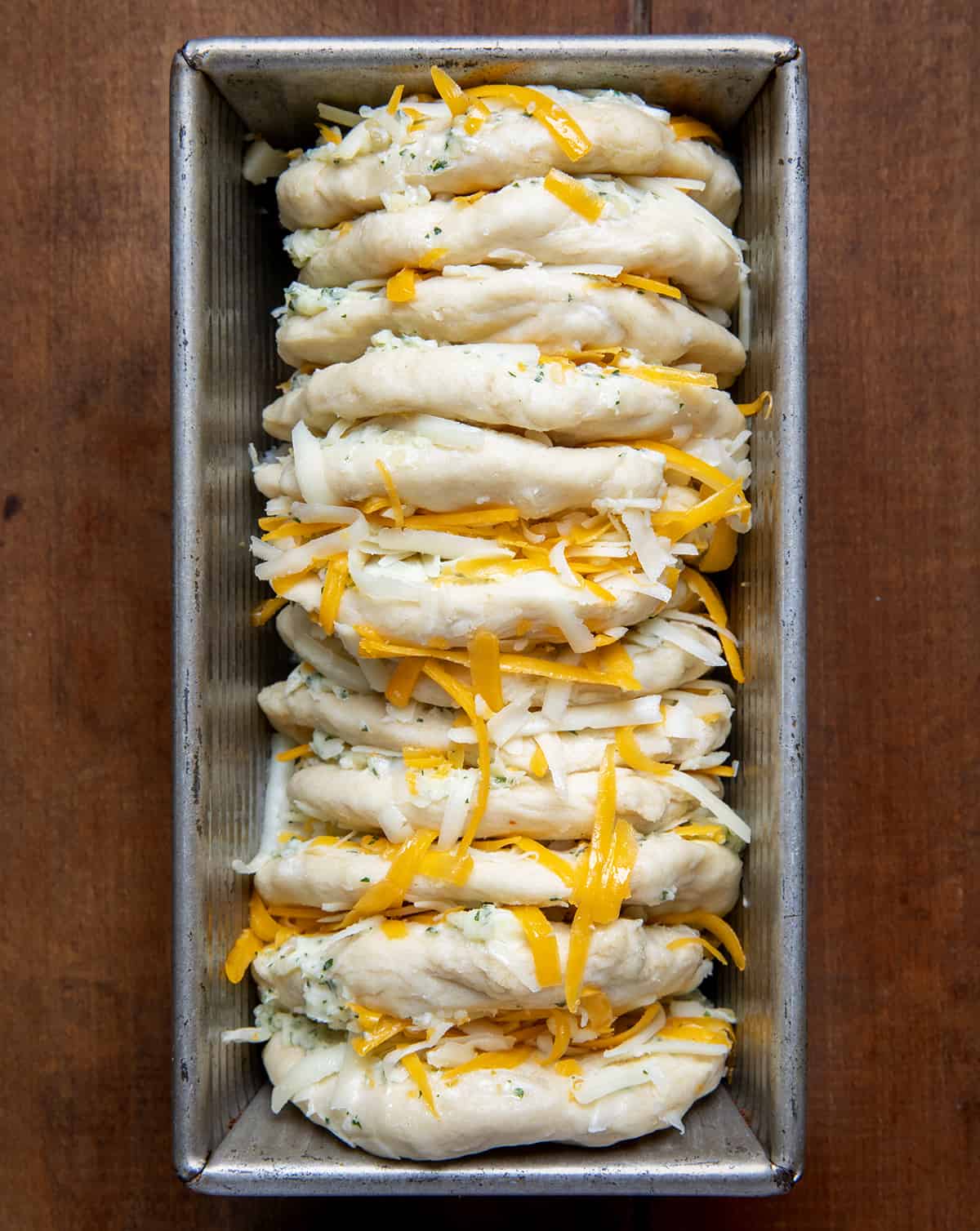 From Scratch Cheesy Garlic Pull-Apart Bread in pan before baking.