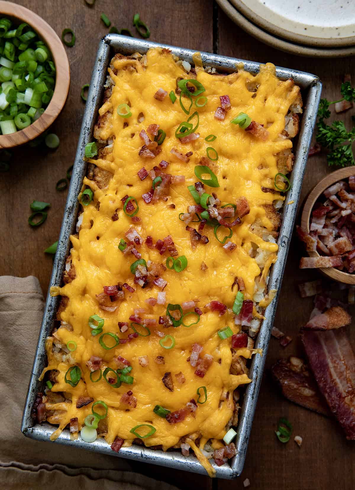 Hash Brown Breakfast Loaf on a wooden table from overhead.