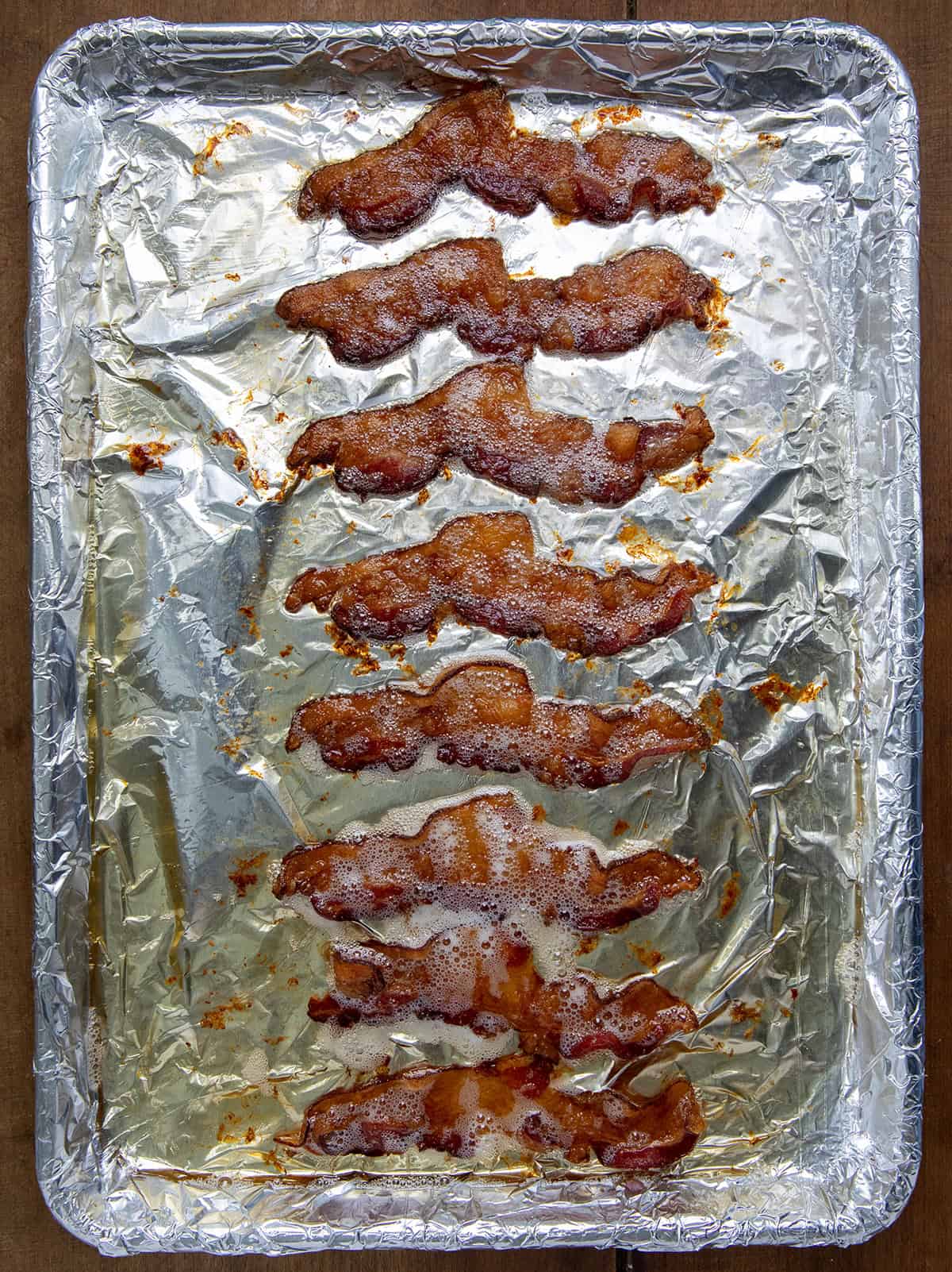 Sheet pan with baked bacon on it.