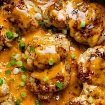 Close up of Bang Bang Chicken Thighs in a skillet from overhead.