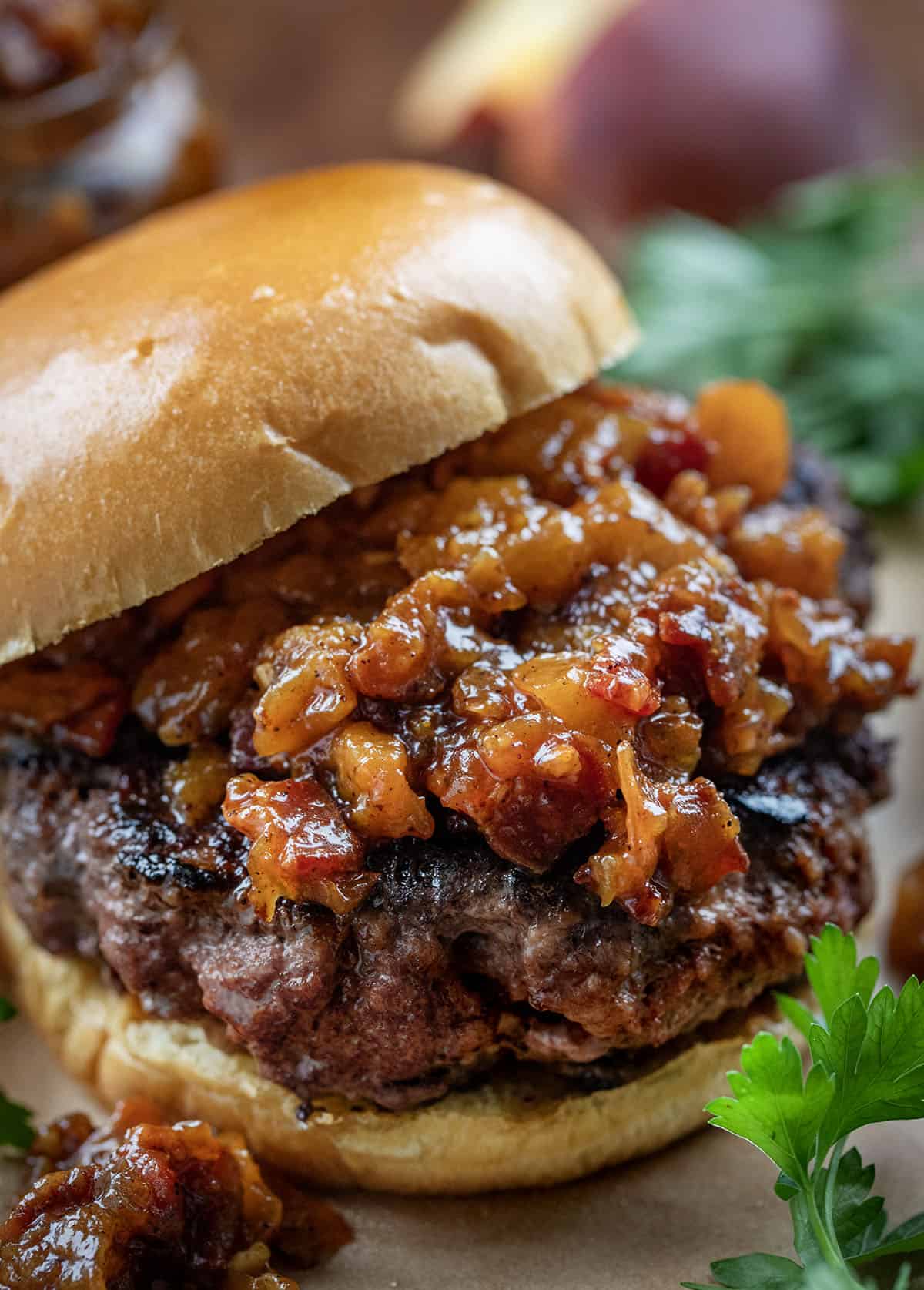 Burger topped with Peach Bacon Jam.