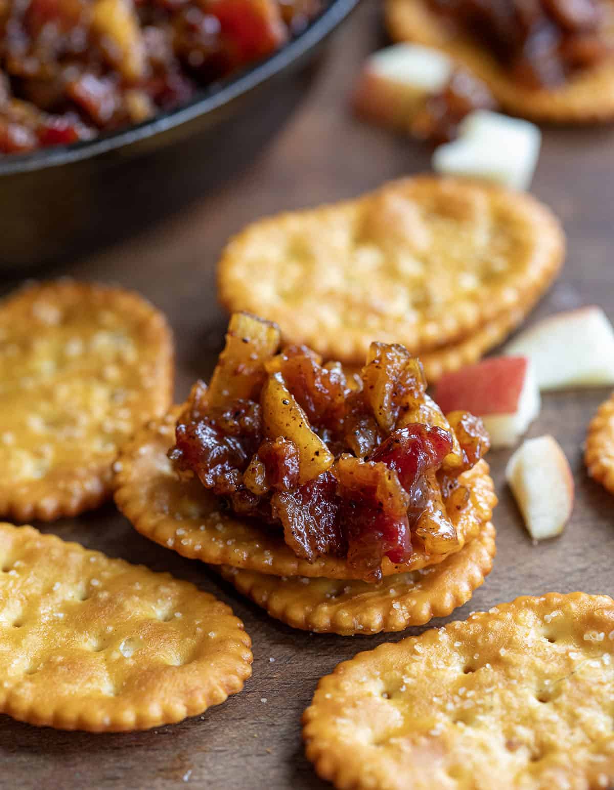 Crackers with Apple Whiskey Bacon Jam on it.
