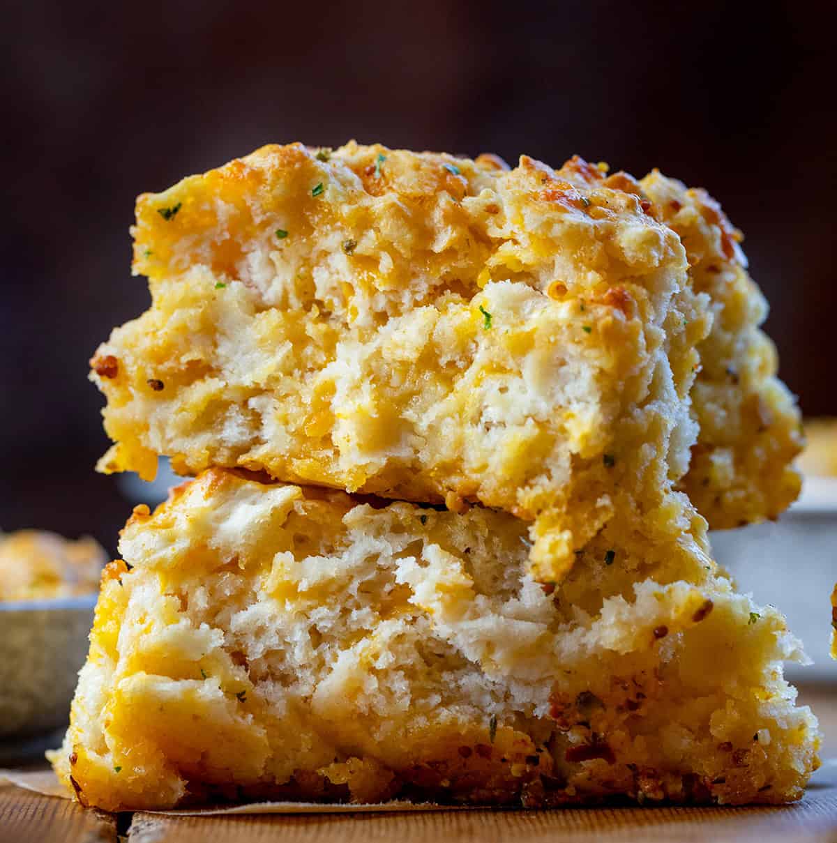 Stack of Cowboy Butter Swim Biscuits on a wooden table.