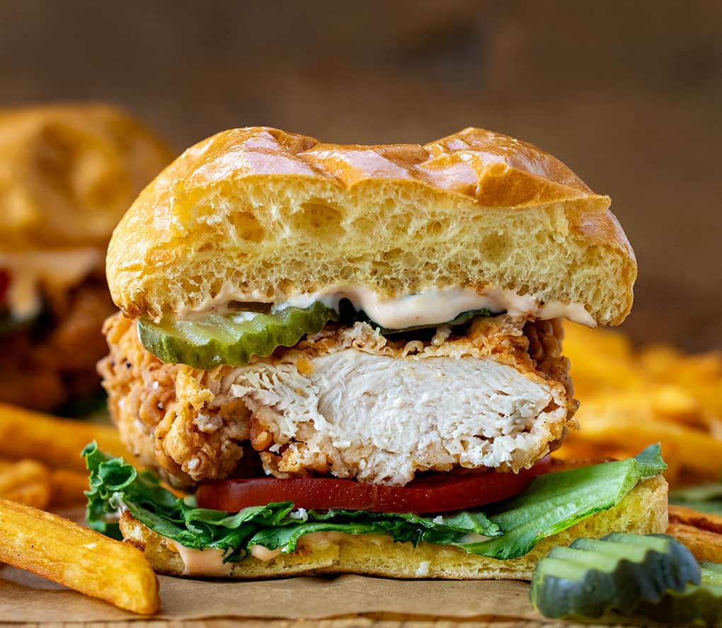 Sliced into Spicy Chicken Sandwich showing tender juicy chicken.