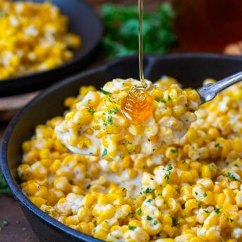 Drizzling honey over a spoonful of Honey Butter Skillet Corn.