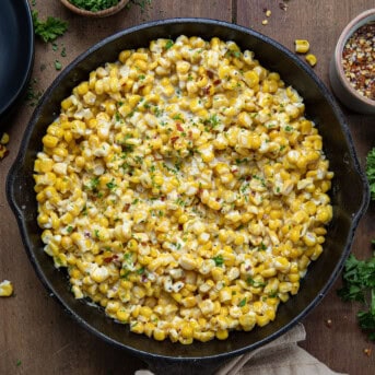 Hot Honey Skillet Corn on a wooden table from overhead.