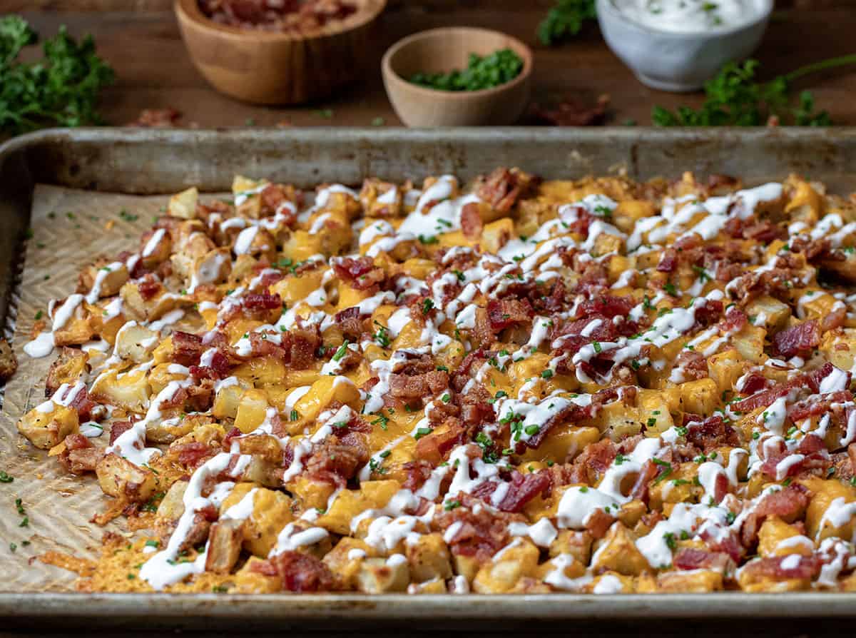 Sheet pan of Loaded Roasted Potatoes.