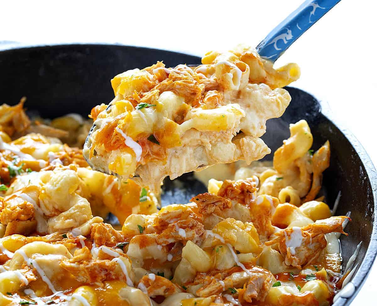 spoon dishing up buffalo chicken macaroni and cheese