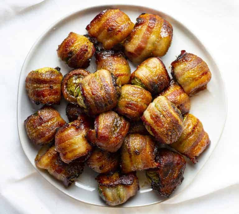 Overhead of a plate of bacon wrapped Brussels sprouts