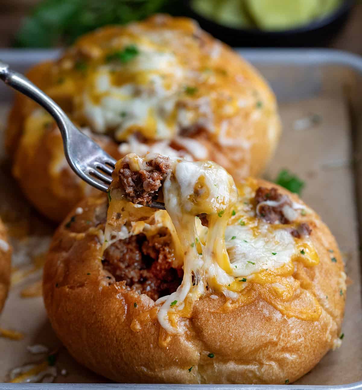 Fork taking a bite from a Sloppy Joe Bread Bowl.