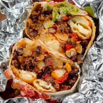 Cut in half Cowboy Burrito wrapped in foil.