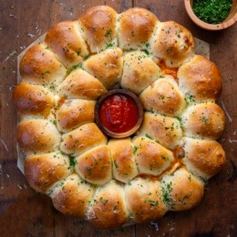 Pizza Bomb Wreath on a wooden table from overhead.