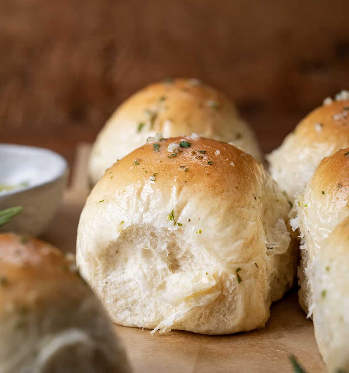 Close up of a light and fluffy Rosemary Dinner Roll.