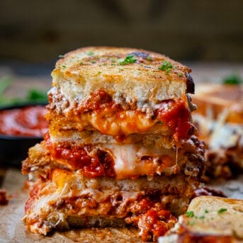 Stack of halved Lasagna Grilled Cheese sandwiches.