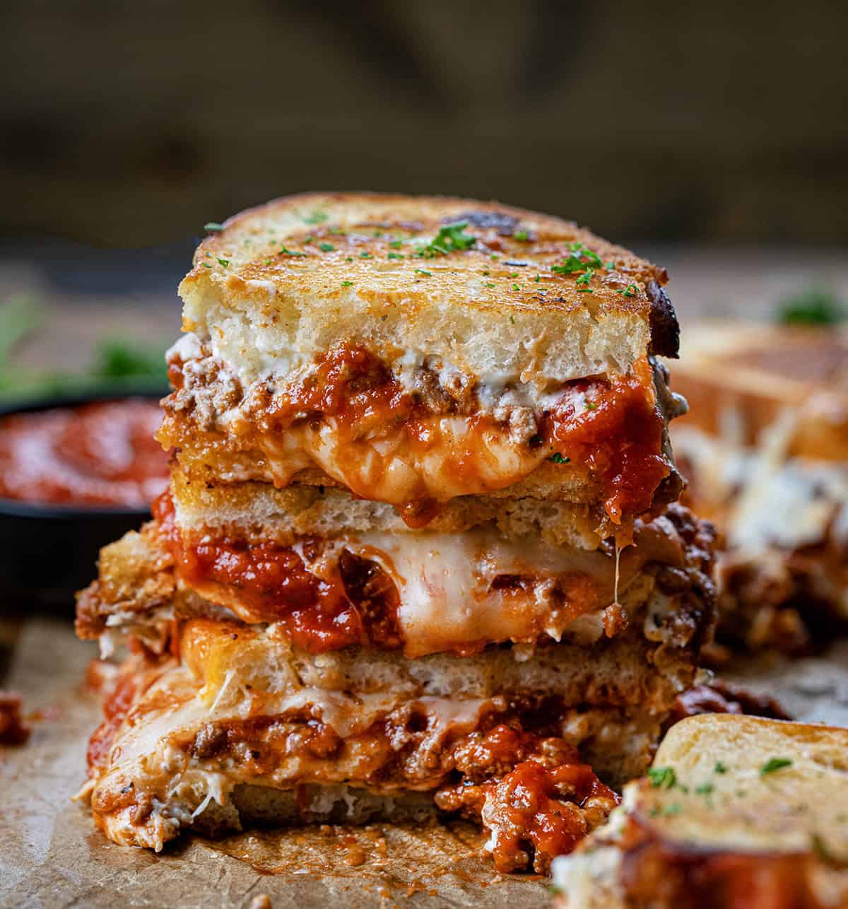 Stack of halved Lasagna Grilled Cheese sandwiches. 