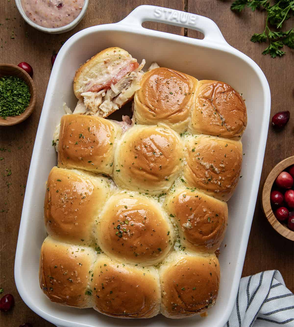 Turkey Melt Sliders on a wooden table from overhead.