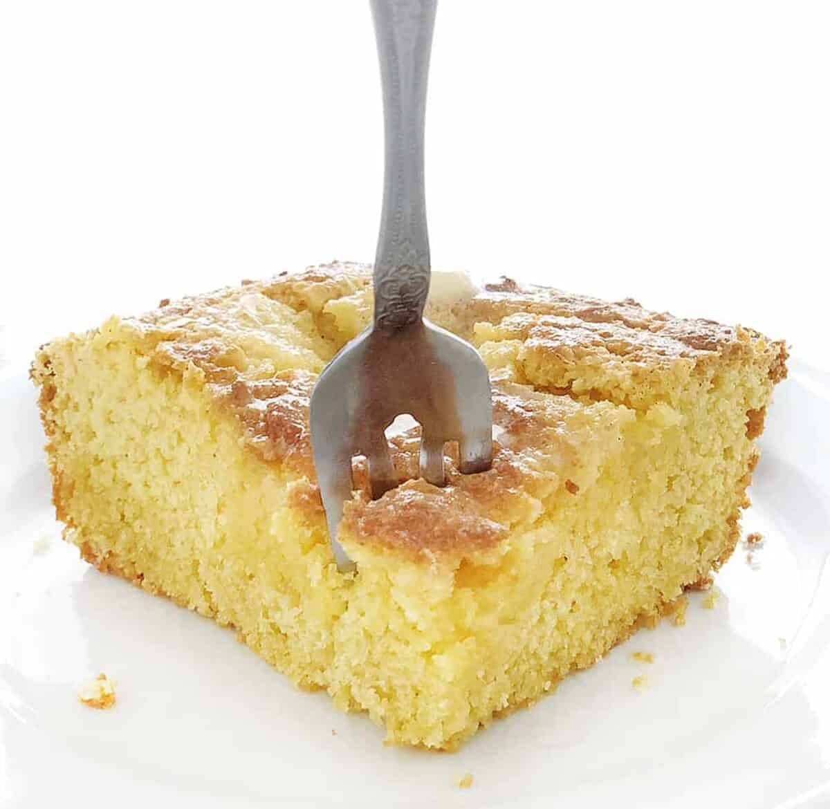 fork in a slice of cornbread