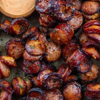 Chipotle Aioli Hasselback Kielbasa Bites in a pan from overhead.