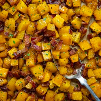 Close up of Maple Bacon Butternut Squash with spoon resting in it.